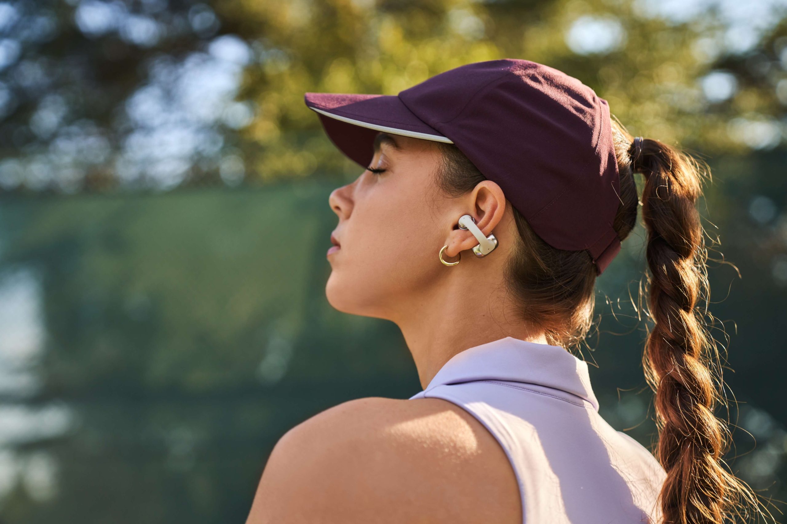 Female person wearing Shokz OpenDots ONE